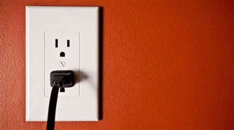 warm electrical outlet meaning